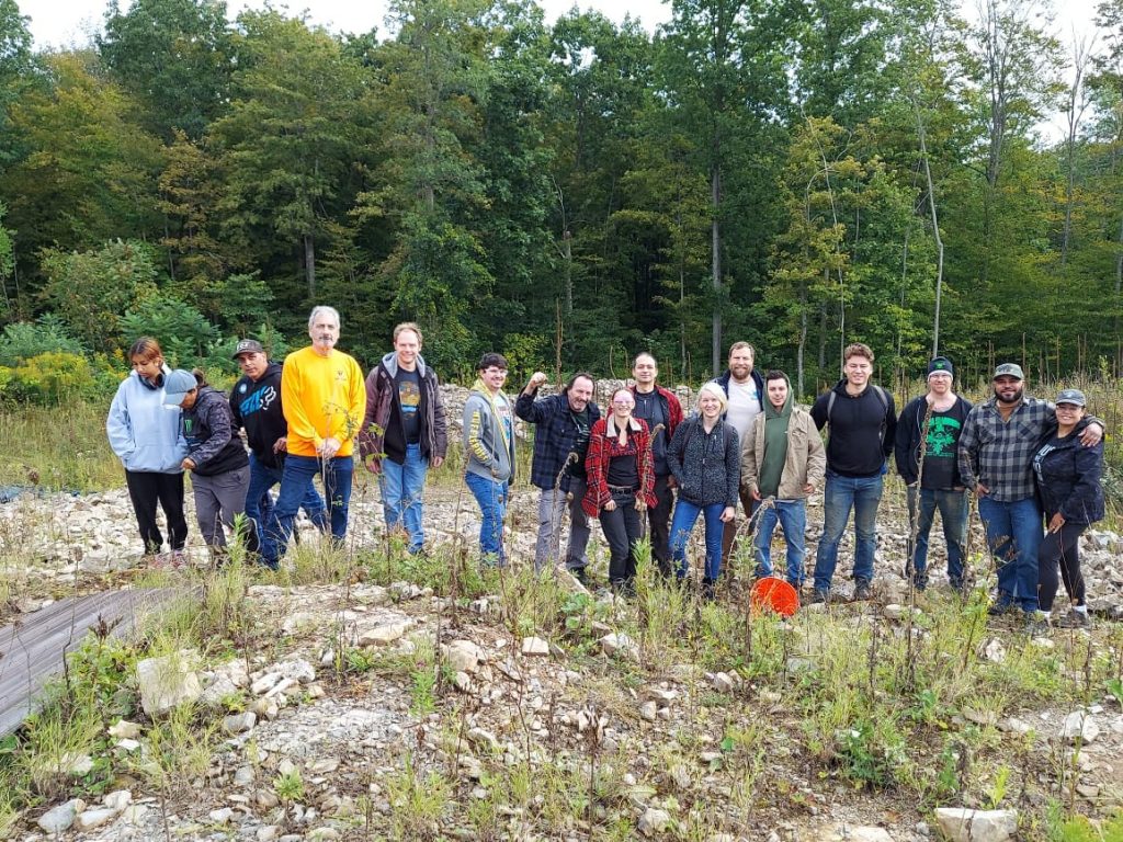 Mineral club group standing together during an outdoor quarry field trip.