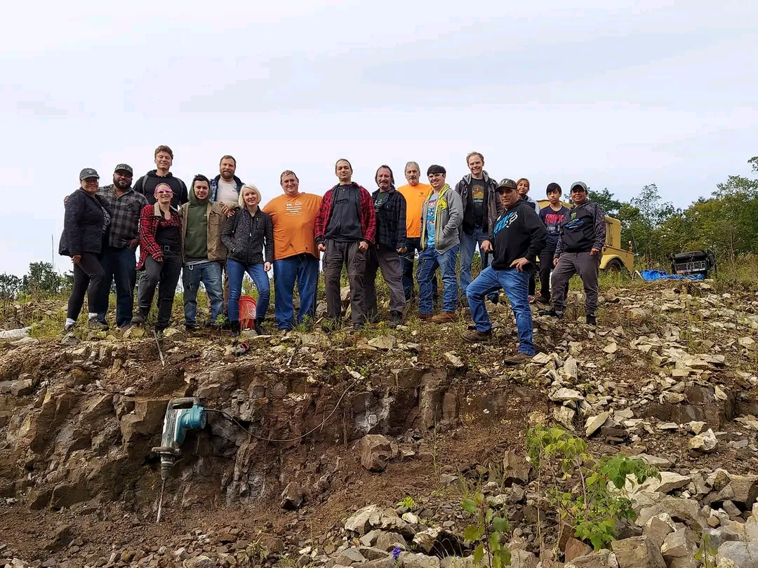 Mineral club members standing together on a quarry field trip